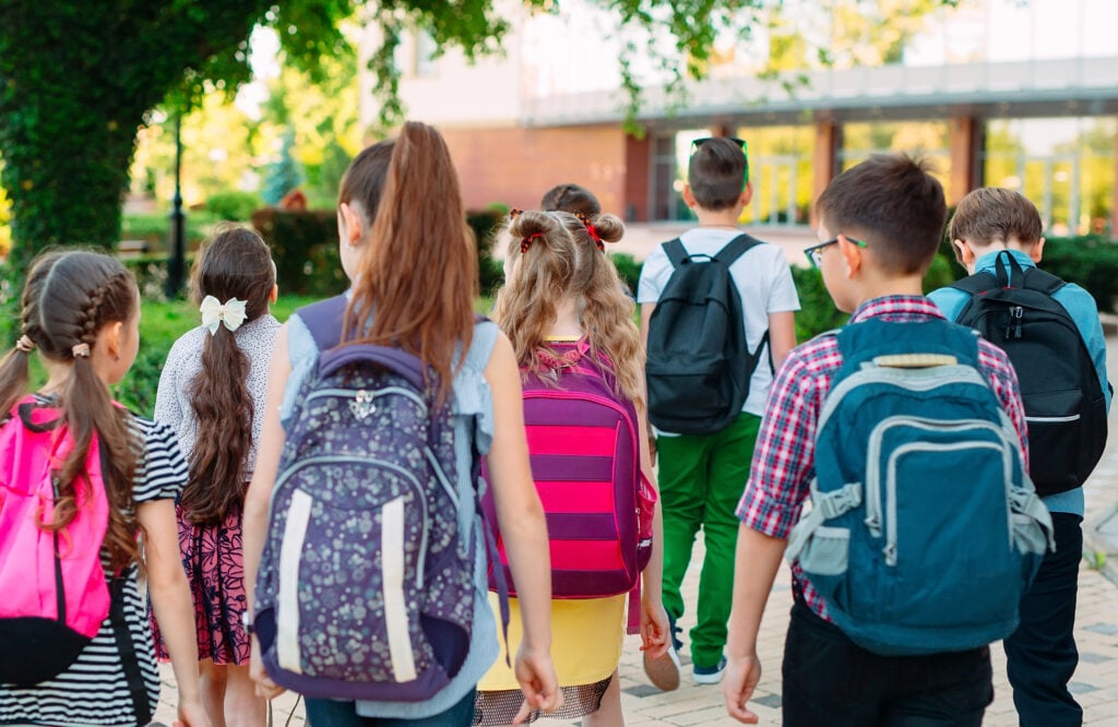 Group of kids going to school together.