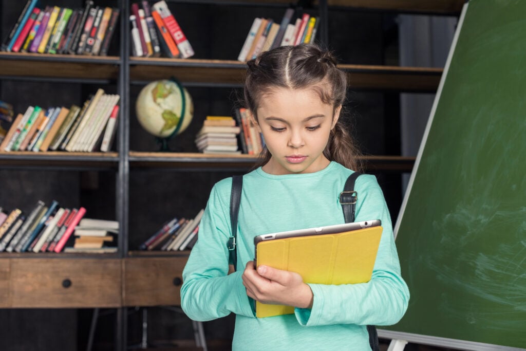 Schoolgirl with digital tablet