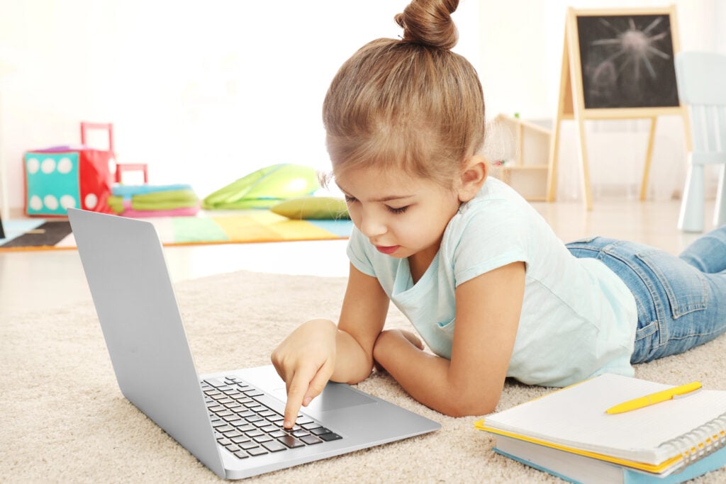 child using laptop for learning