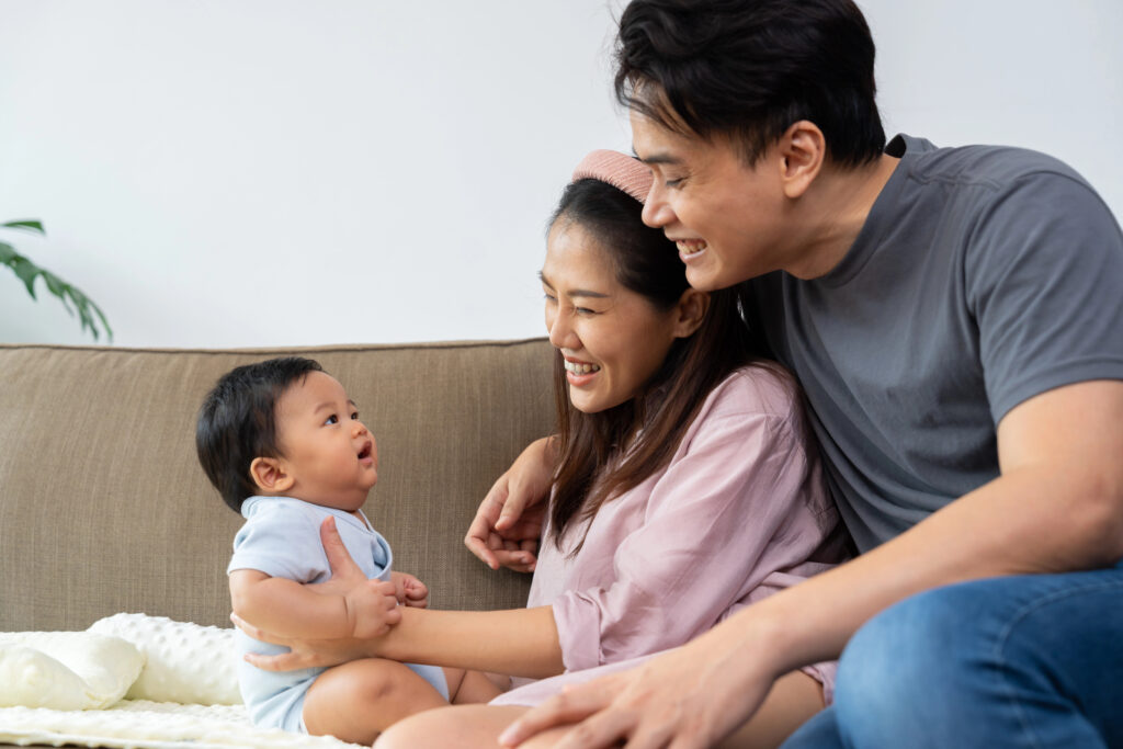 A loving parent embraces their infant, sharing warmth and innocence in a moment of deep connection. This happy family cherishes parenthood, strengthening their relationship through beauty of parenting
