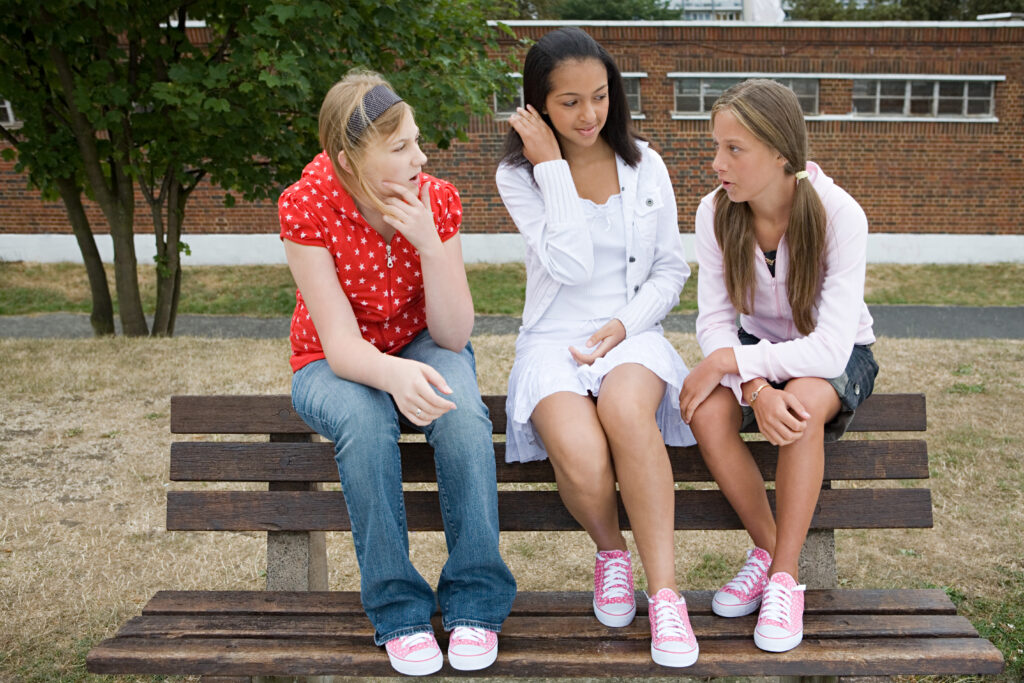 Girls talking on bench