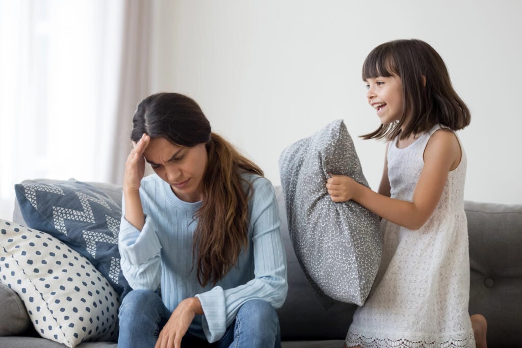 Stressed mom suffer from headache annoyed by loud child