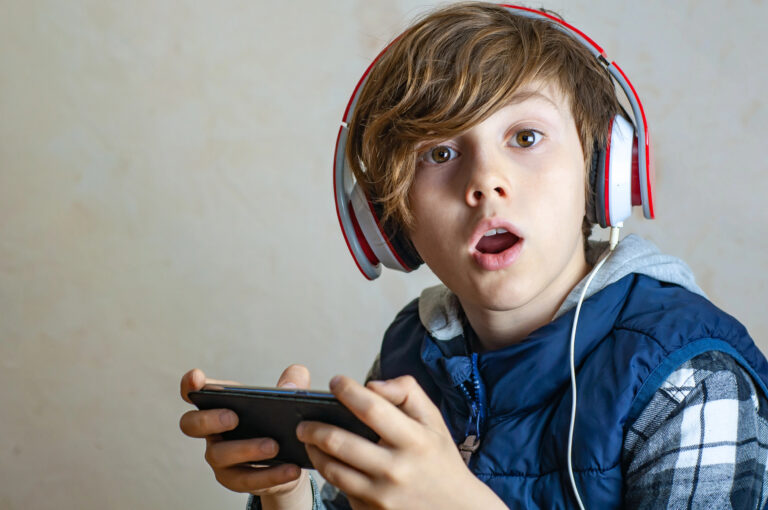 surprised teen playing game
