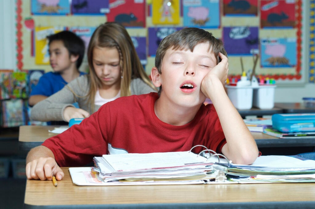 Boy Sleeping In Classroom