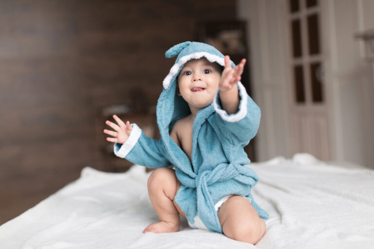 baby boy in blue robe
