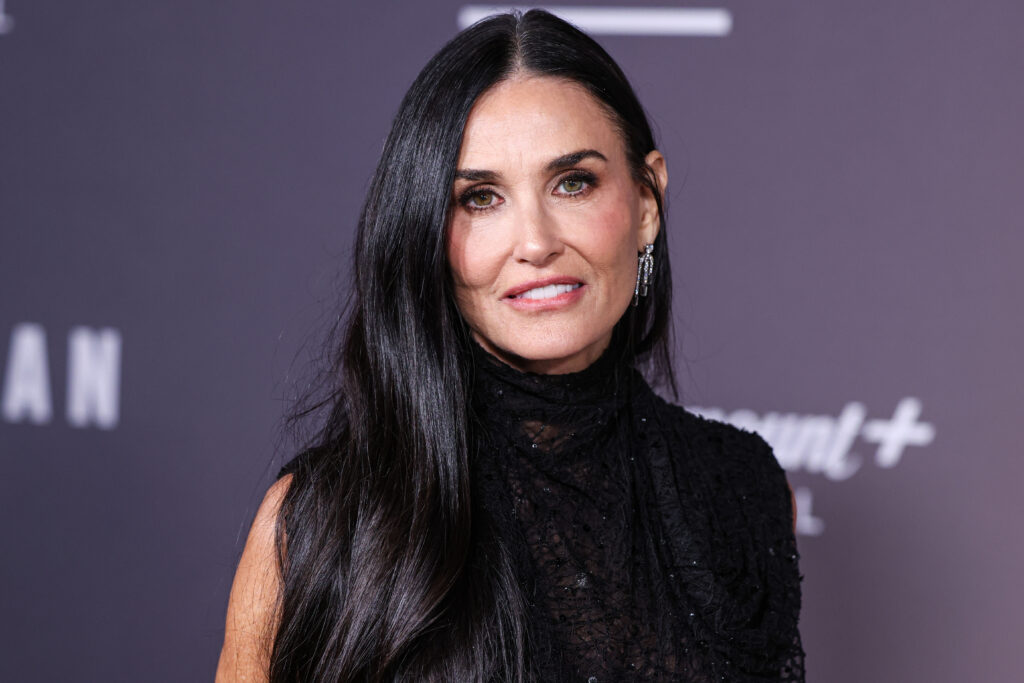 Demi Moore wearing Erdem arrives at the Los Angeles Premiere Of Paramount+'s Original Series 'Landman' Season 1 held at the Paramount Theatre at Paramount Pictures Studios on November 12, 2024 in Hollywood, Los Angeles, California, United States.