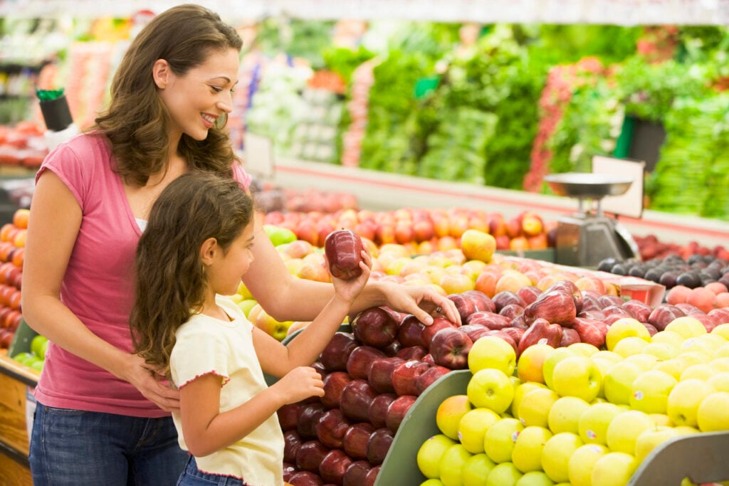 Mother and daughter shopping for fresh produce