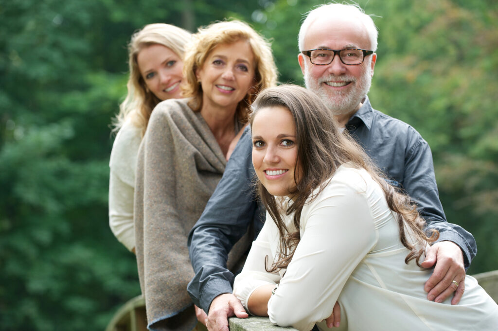 Smiling family happy together outdoors