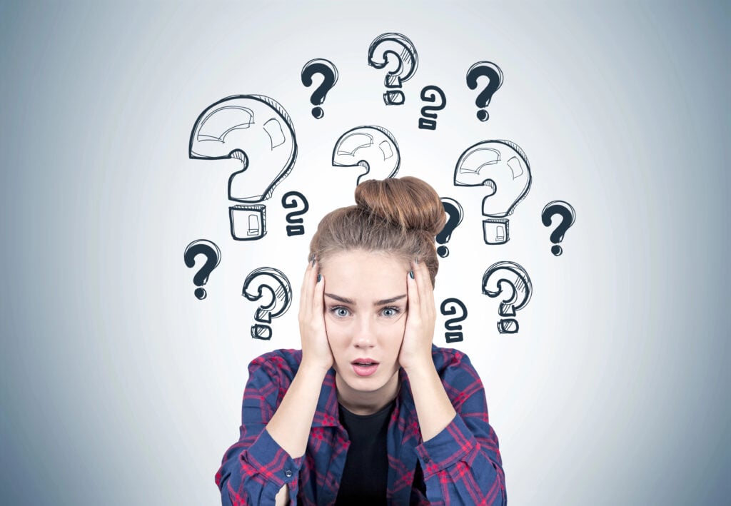 Stressed teen girl, question marks