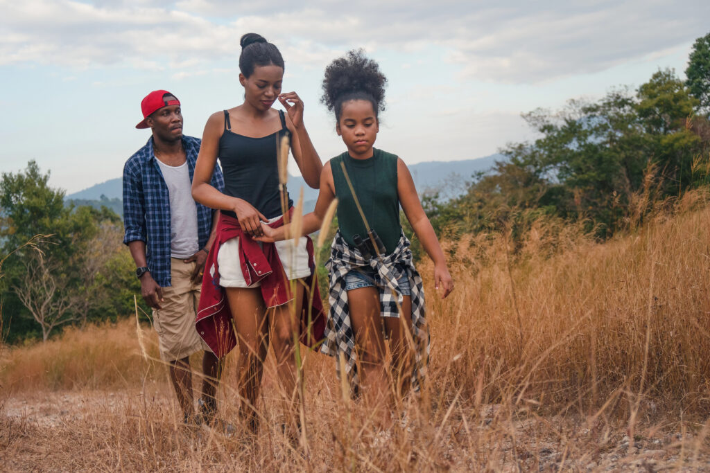 african american family having fun traveling and camping togethe