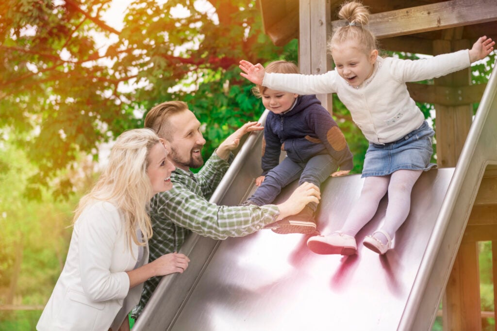 young family in park with chilfren