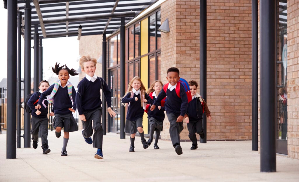 elementary kids running out to recess