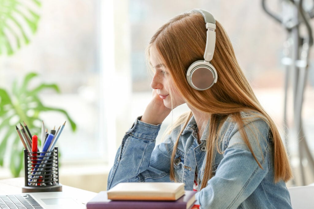 Cute teenage girl doing homework