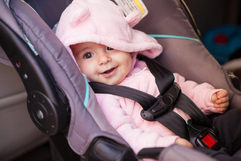 girl sitting on a car seat