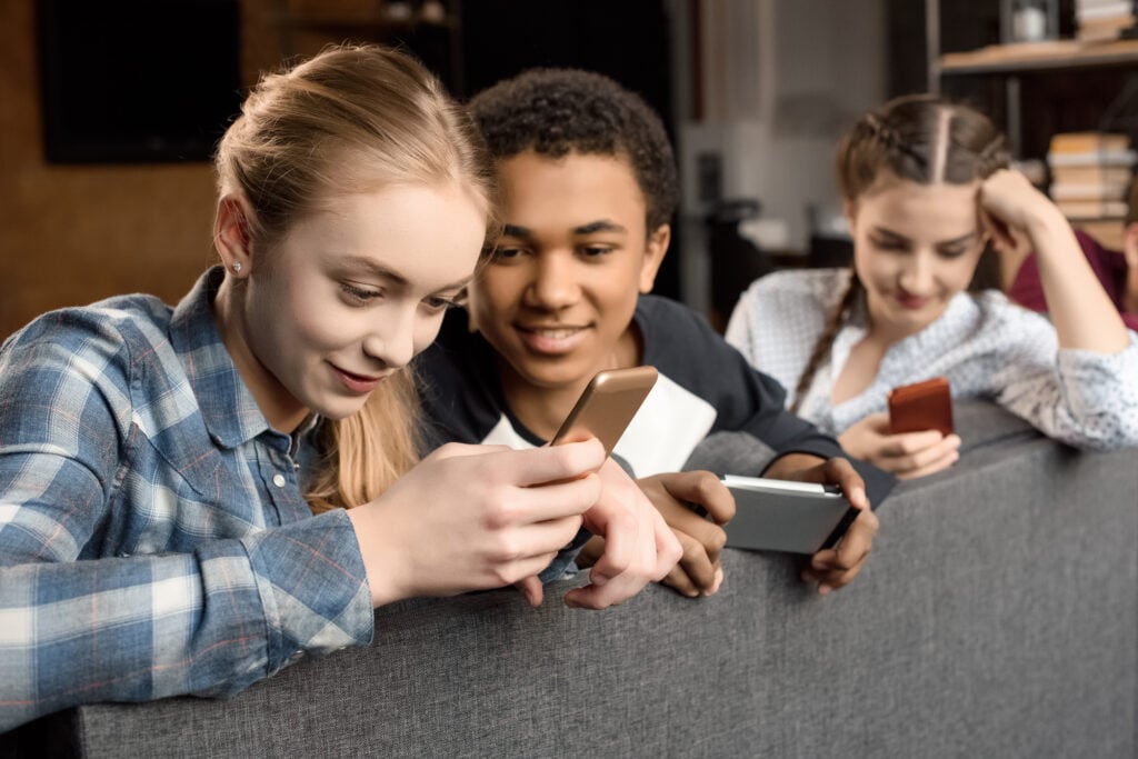 teenagers using smartphones