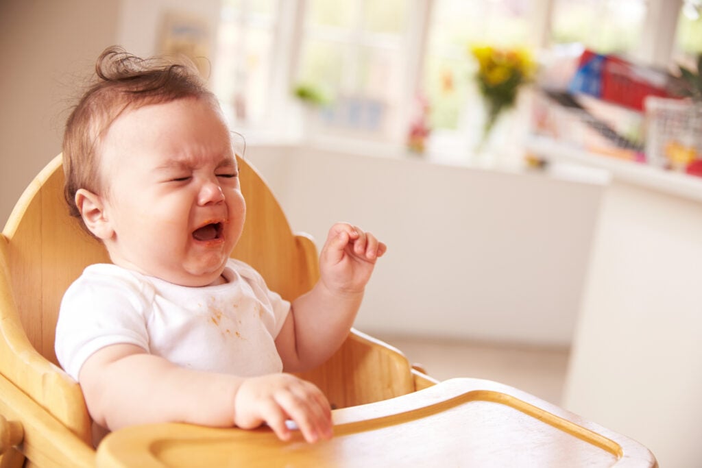 Unhappy Baby At Meal Time