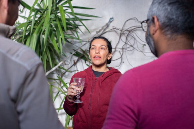 Parents having a discussion at a party.